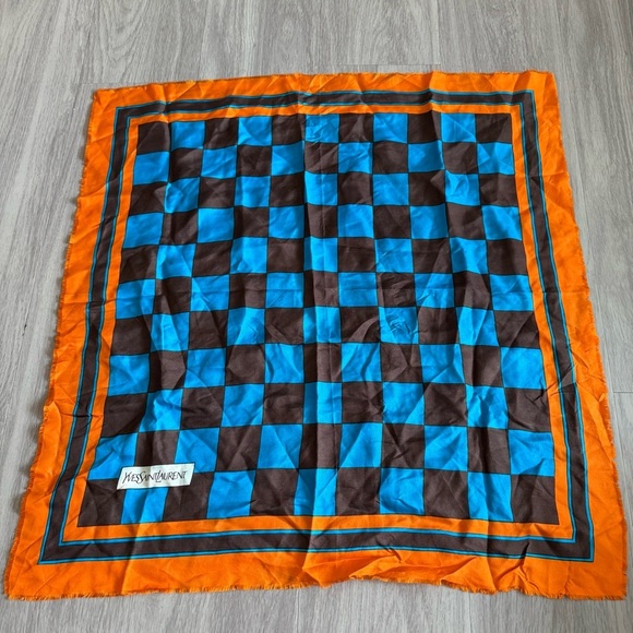 Yves Saint Laurent Silk Raw Hem
26” x 26”
Color Orange Blue Brown - Picture 2 of 4